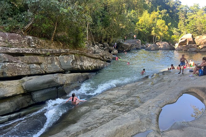 El Yunque Rainforest- Water Slide, Luquillo Beach Guided Tour - Las Pailas Water Slide Experience, Life Jackets, and Volcanic Rock Swims