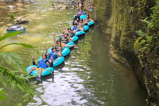 Rainforest Cave Tubing Adventure - Tubing through cave formations and under waterfalls
